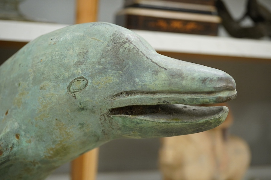 A patinated bronze dolphin group, 49cm high. Condition - some foxing to surface